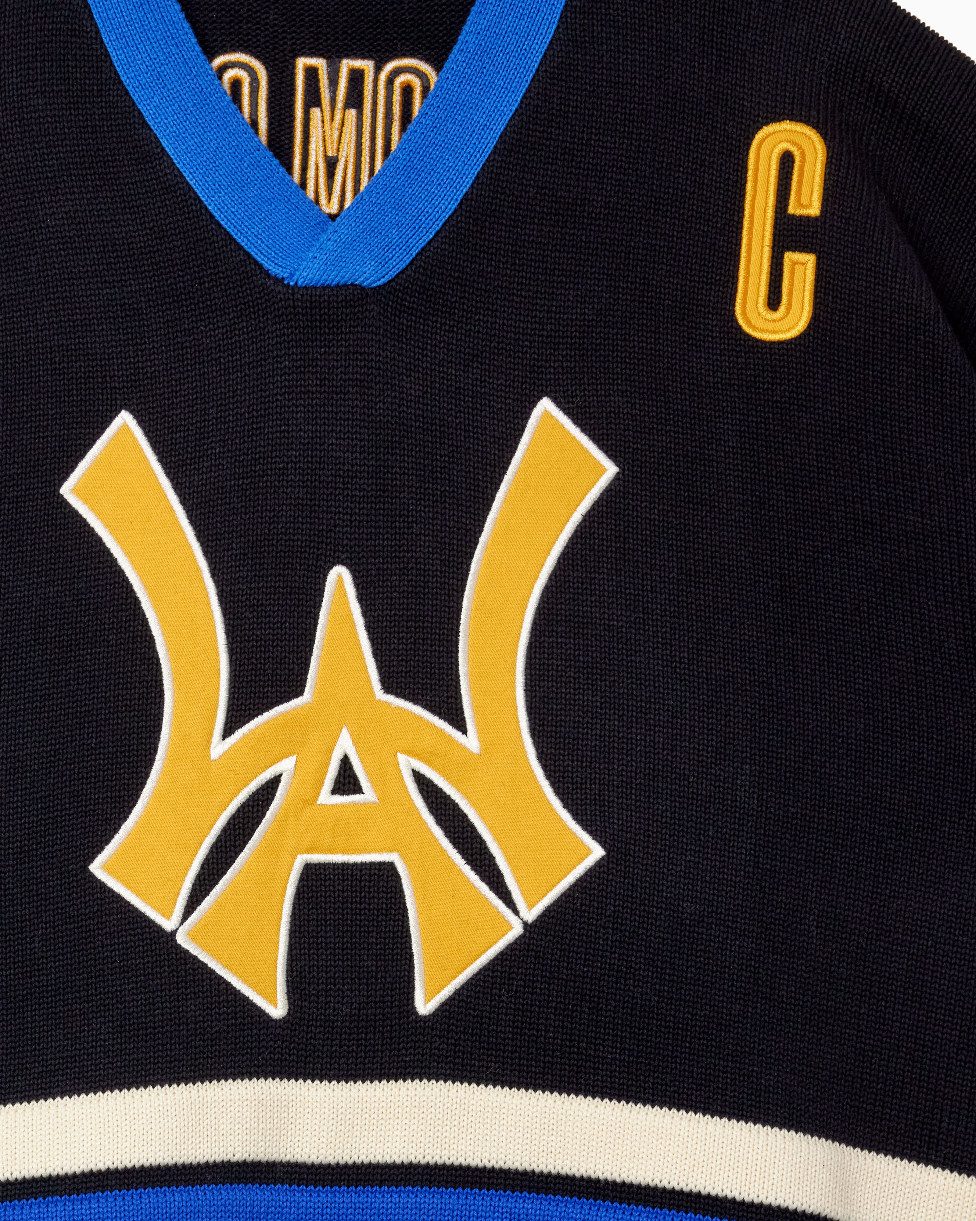 Close Up Of The Wisdom Of Age Knit Hockey Jersey Black Front View