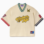 Knitted Baseball Jersey in Cream with 'Wisdom of Age' written in text and various logos on a white background