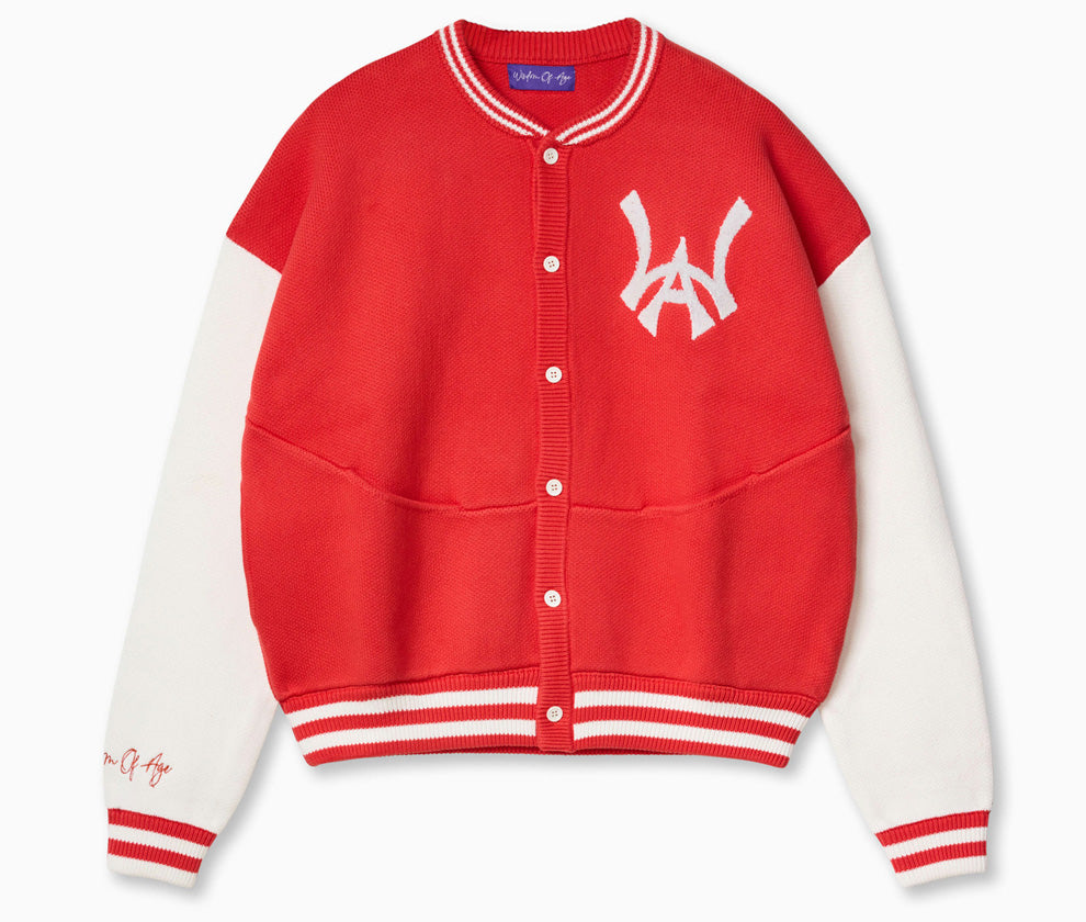 Wisdom of Age University Cardigan. Color wave of Varsity Red and varsity design, with WA logo on the left chest and the brand name “Wisdom of Age” written in script cursive on the right sleeve. Featuring a 5 button placket with dual side seam slip-in pockets.