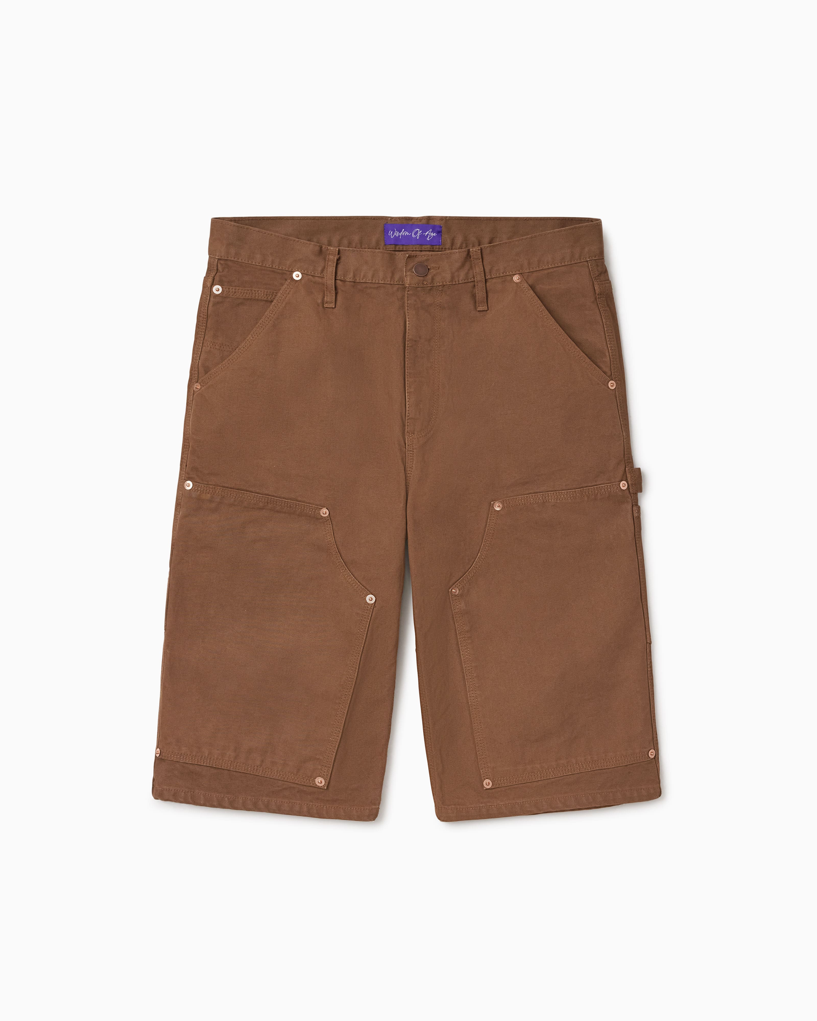 WOA Canvas Carpenter Shorts in Brick with WOA brand label on a white background