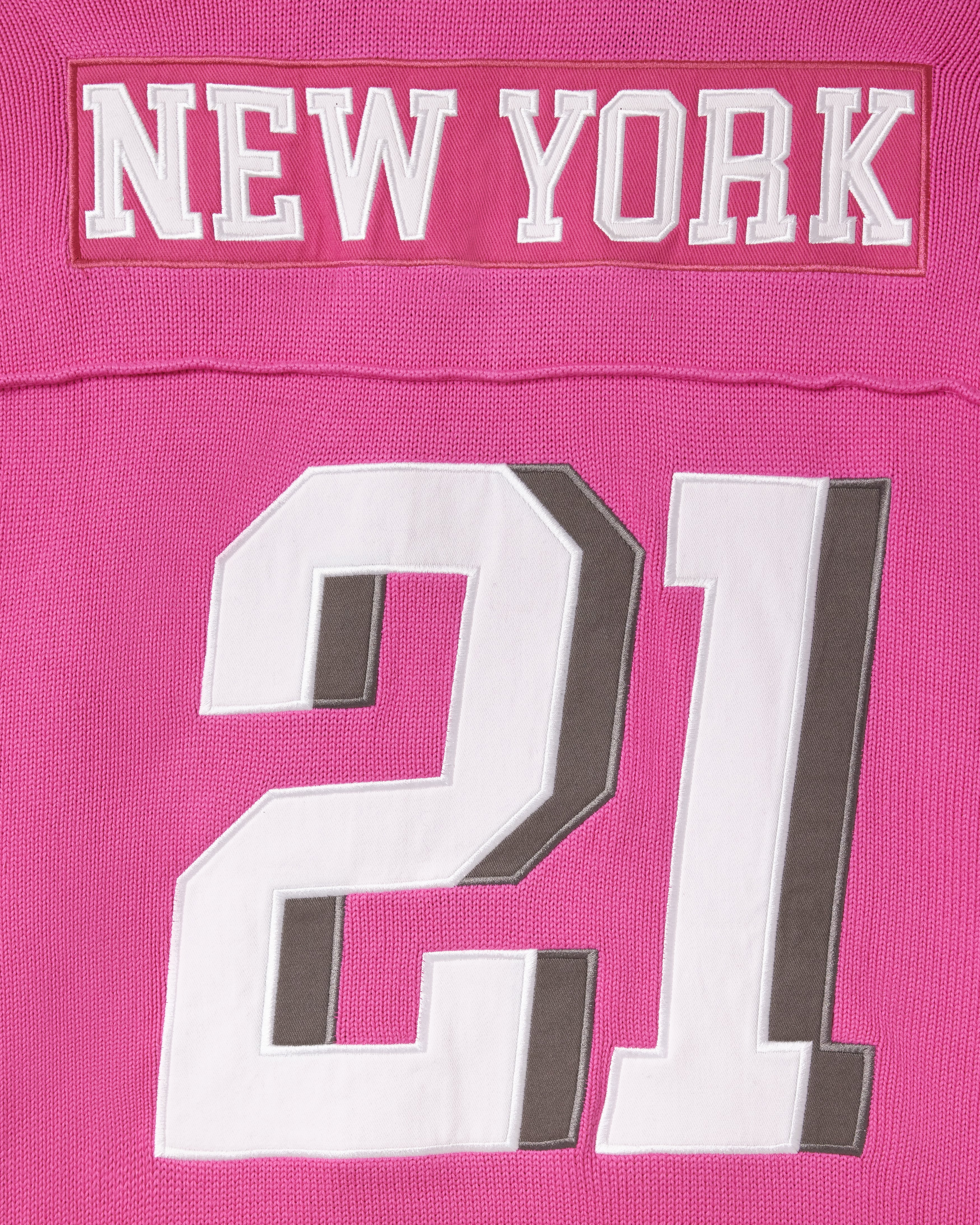 Pink knitted football jersey with 'New York' and number '21'