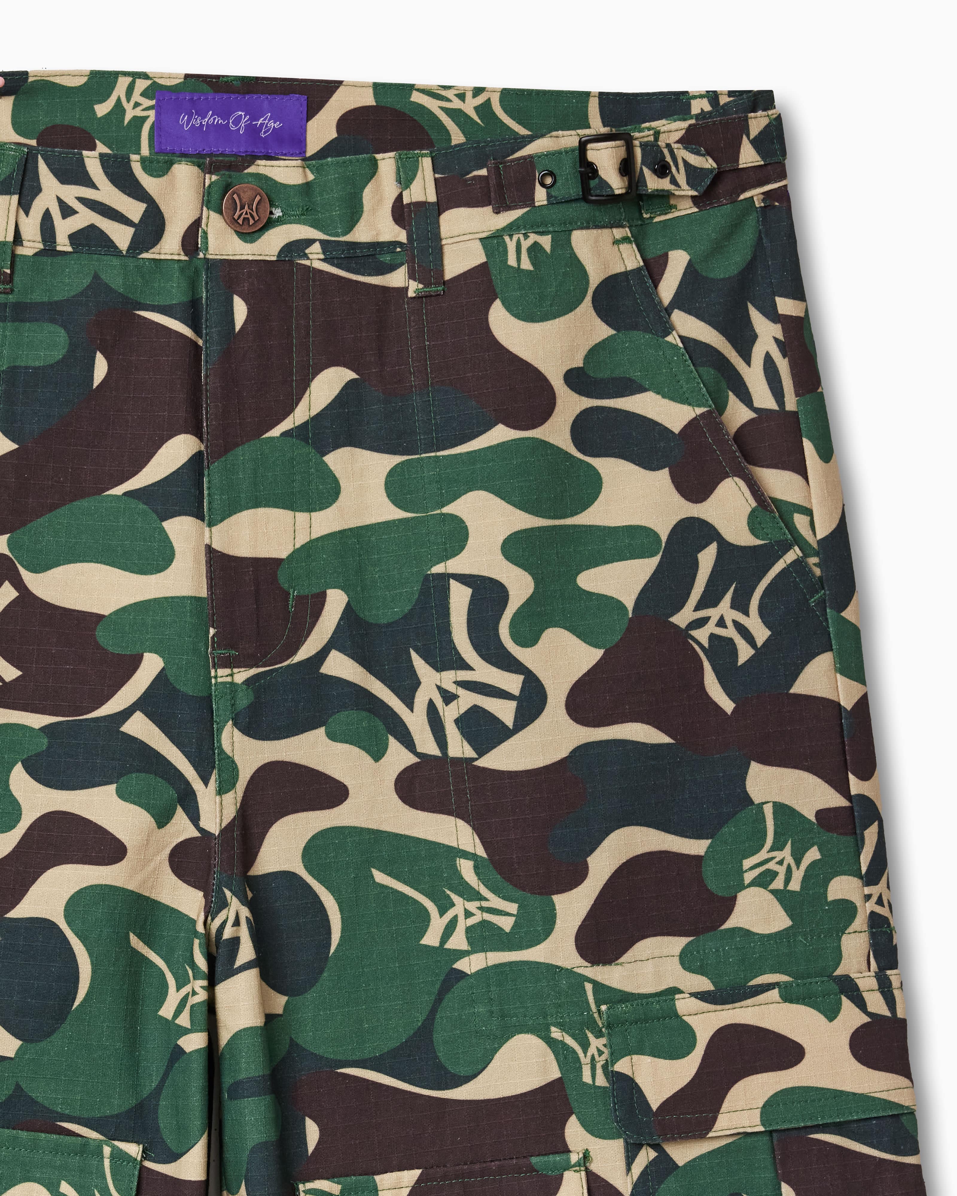 Camouflage pants with the Wisdom Of Age label on a white background