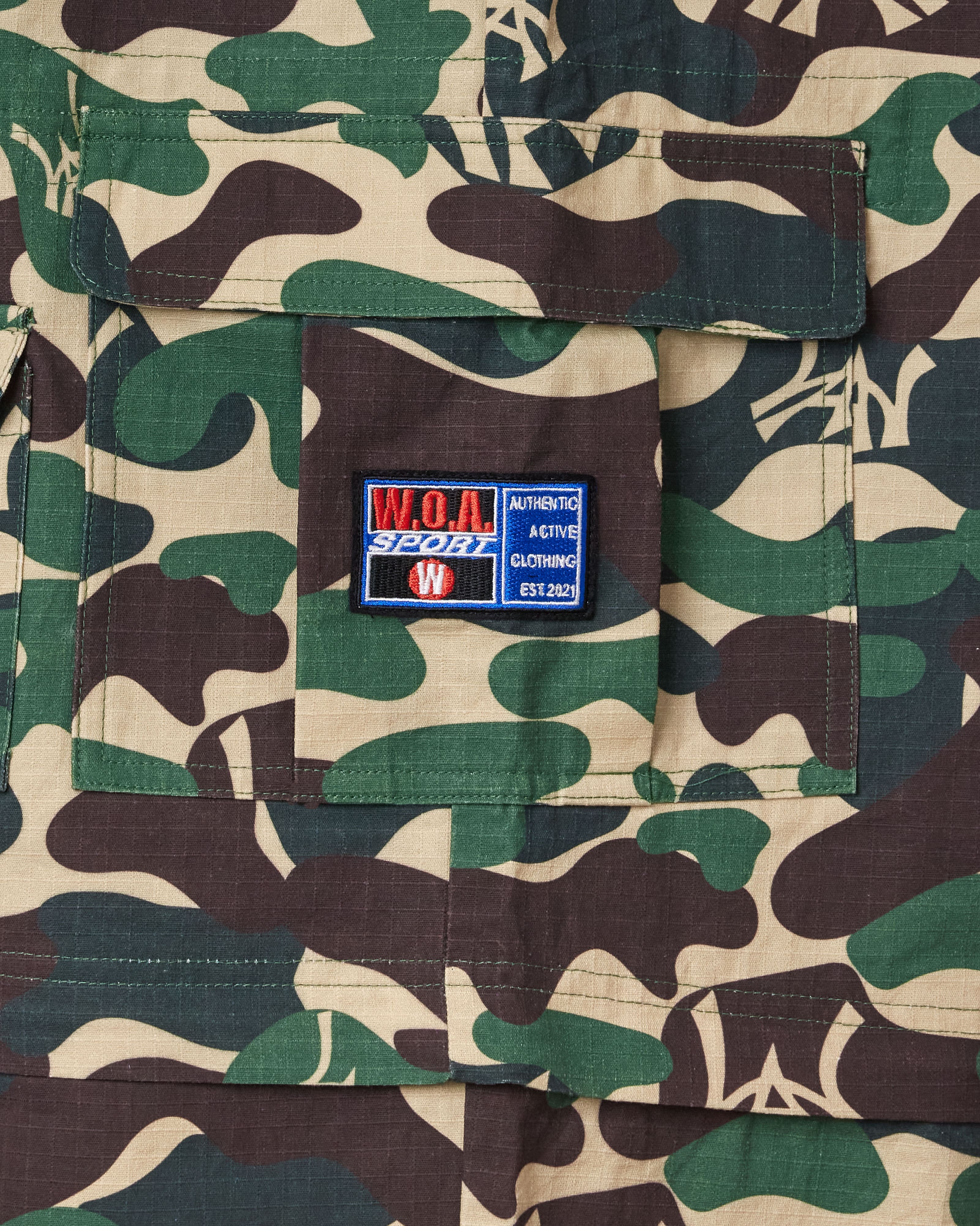 Camouflage fabric with the W.O.A patch on a pocket