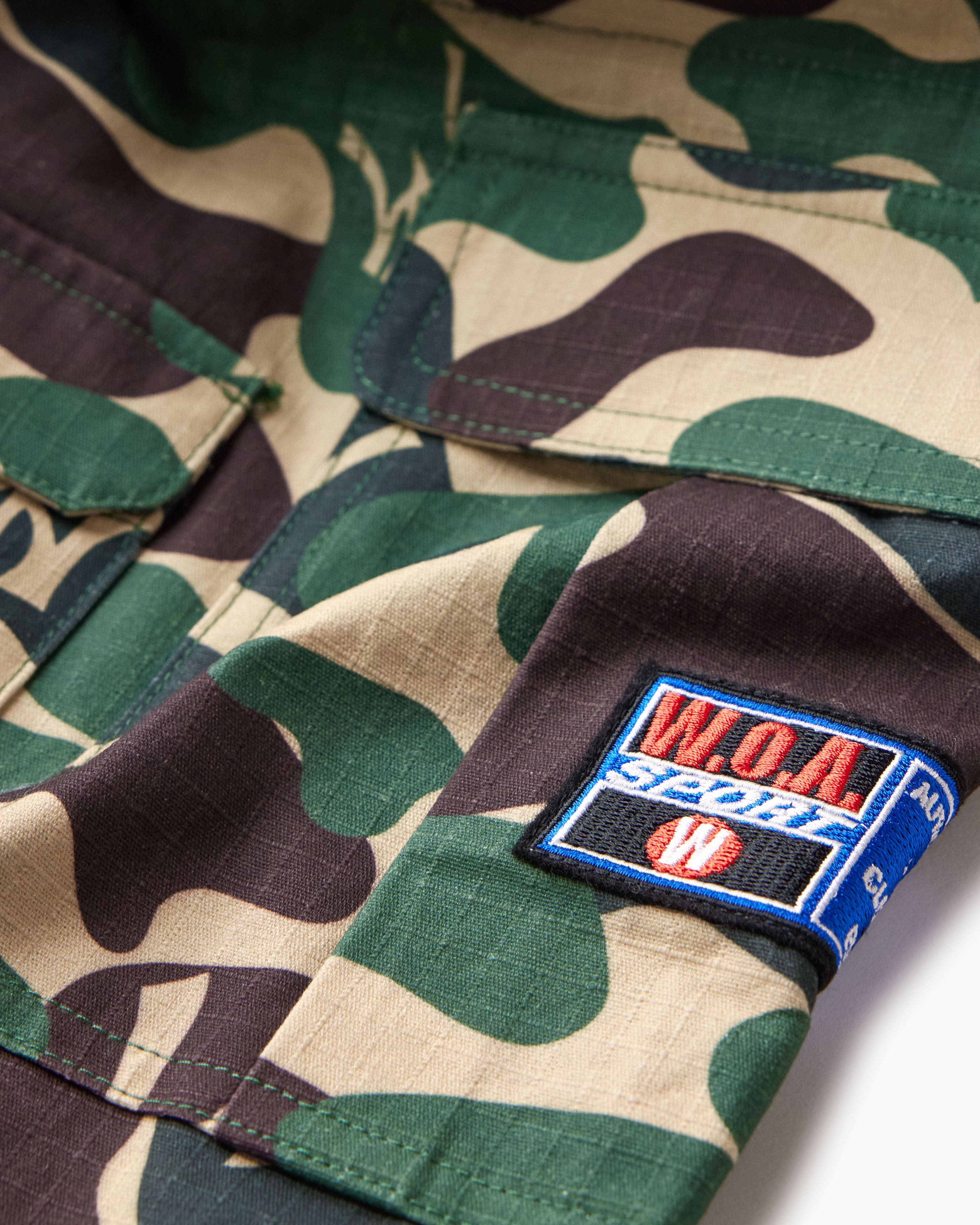 Camouflage fabric with the W.O.A patch on a white background