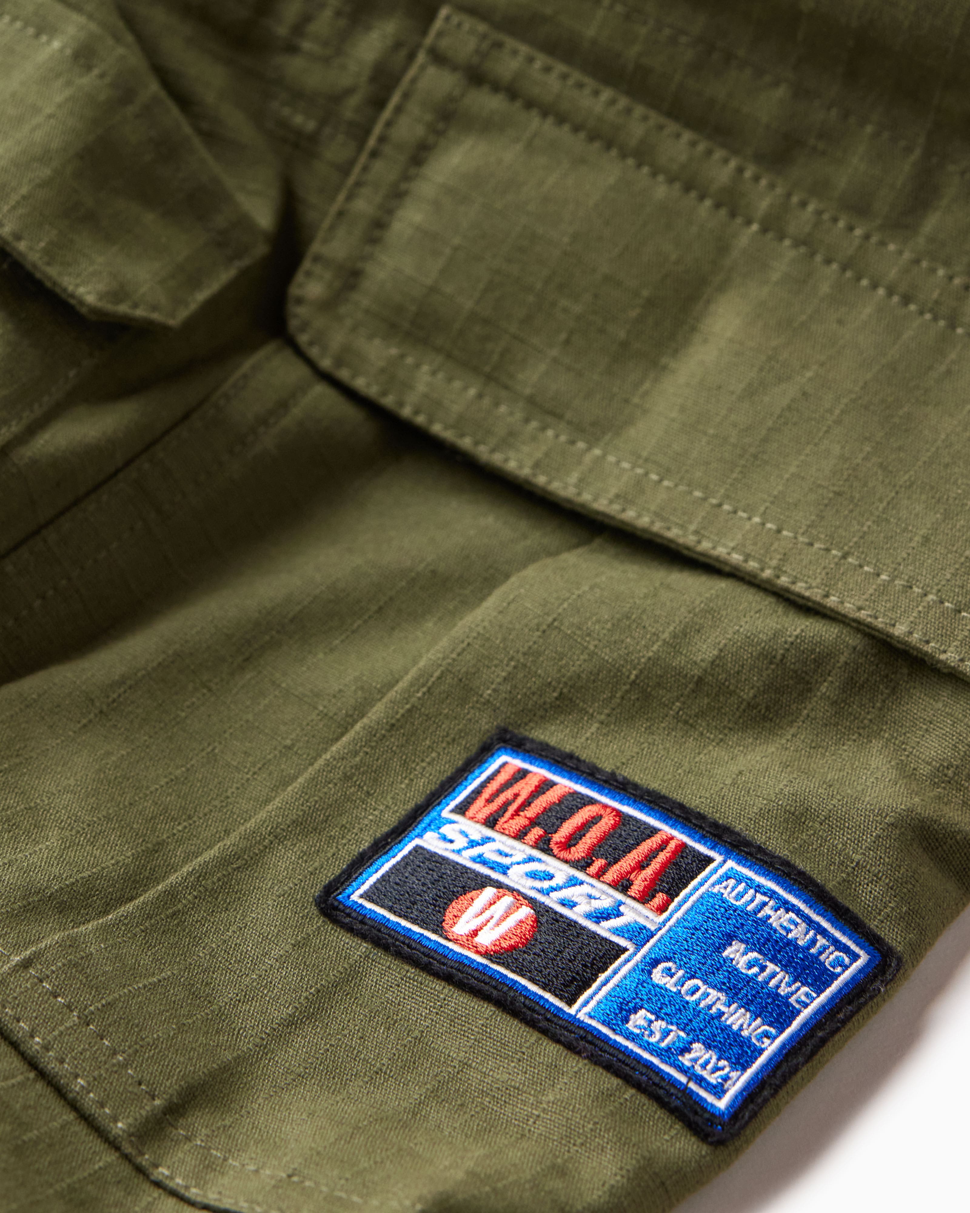 Close-up of the W.O.A patch on a white background