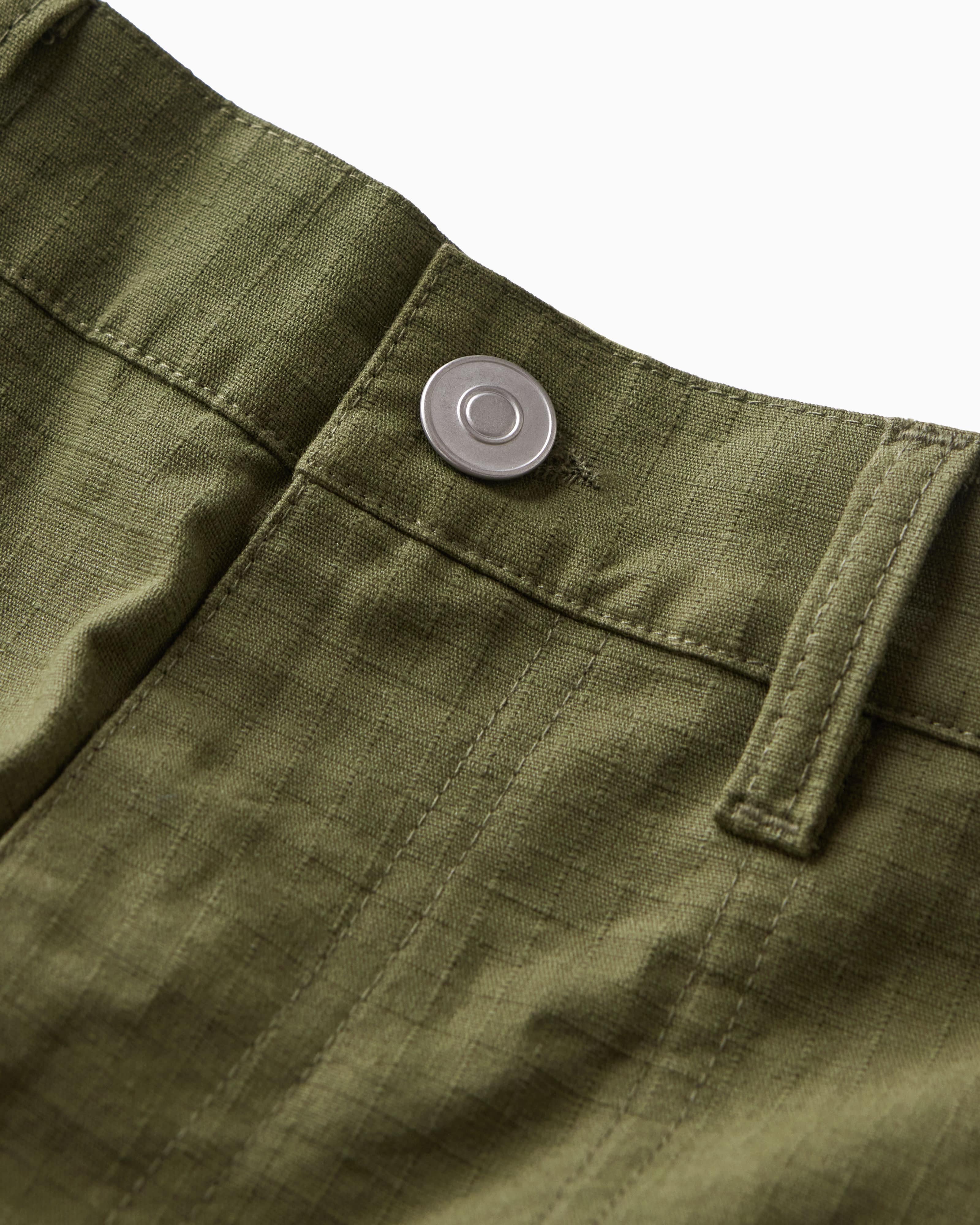 Close-up of the pants button on a white background