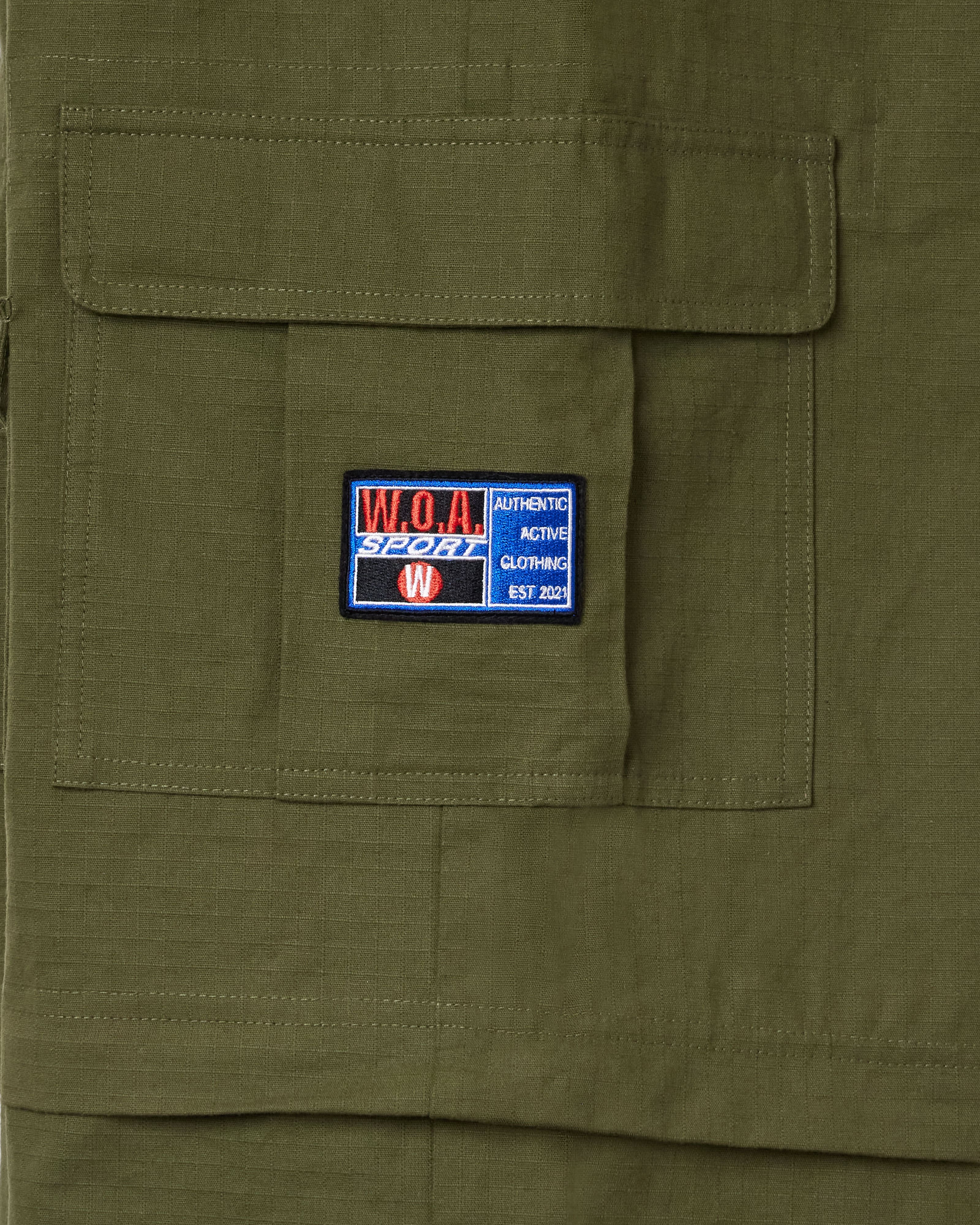 Olive Green Cargo Pants with The W.O.A patch on the pocket