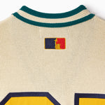 Close-up of a knitted jersey with the WOA Liberty logo