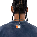 Rear view Male Model wearing a navy sweatshirt with the 'NY Tough' logo on the neck.