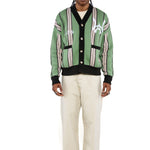 Male model wearing the WOA City cardigan mint on a white background