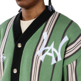 Close up of a Male model wearing the WOA City cardigan mint on a white background.'WA' Logo on the left chest