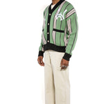 Side view of Male model wearing the WOA City cardigan mint on a white background.