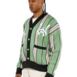 Close, sideview of a Male model wearing the WOA City cardigan mint on a white background. 'WA Logo' embroidered on the left chest.