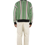 Rear full body view of a Male model wearing the WOA City cardigan mint on a white background.