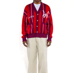 Front full body view of Male Model wearing the Wisdom Of Age City Cardigan in Red Velvet on a white background.
