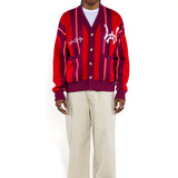 Front full body view of Male Model wearing the Wisdom Of Age City Cardigan in Red Velvet on a white background.
