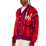 Front side view of a male model wearing the Wisdom Of Age City Cardigan in Red Velvet on a white background.