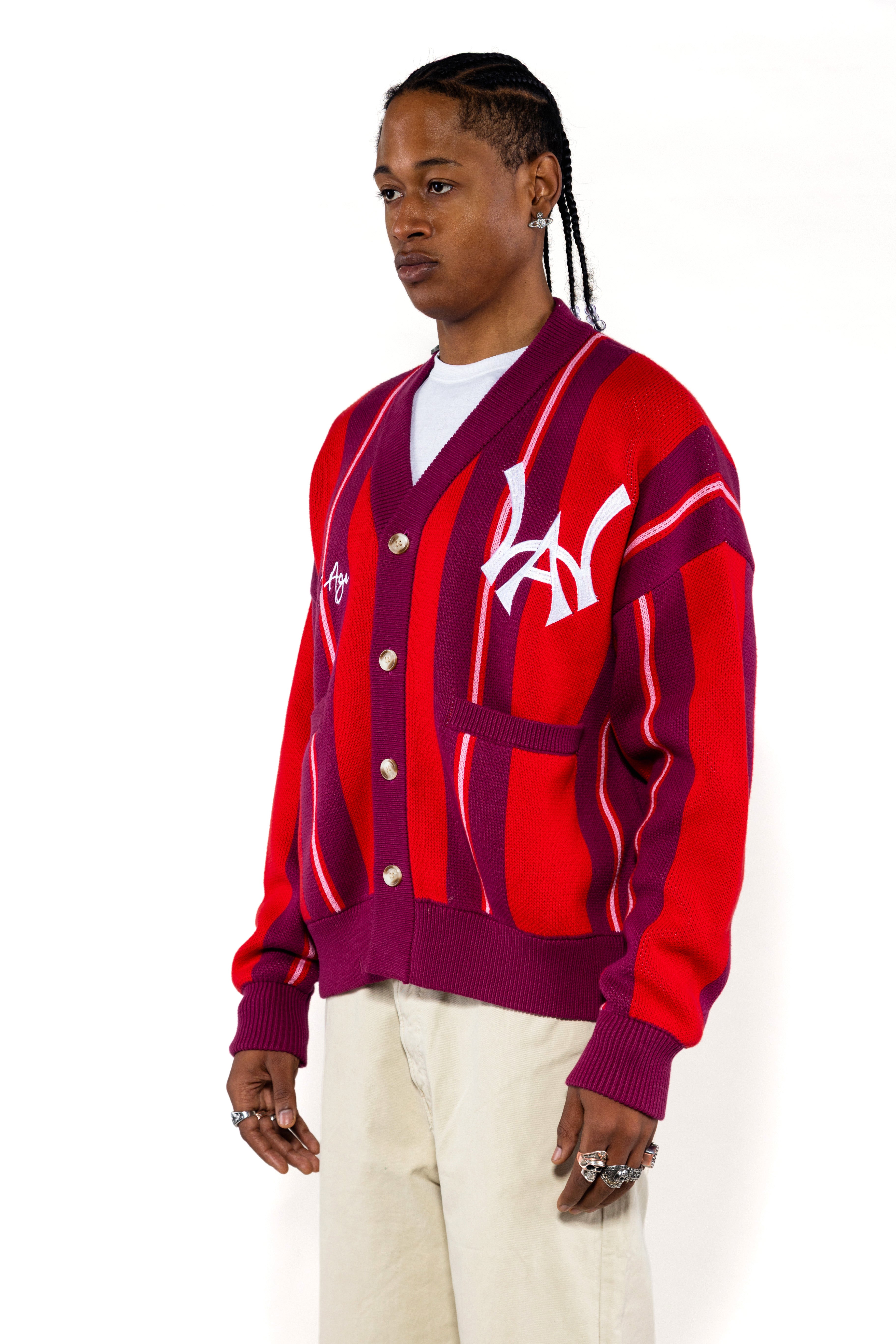 Front side view of a male model wearing the Wisdom Of Age City Cardigan in Red Velvet on a white background.