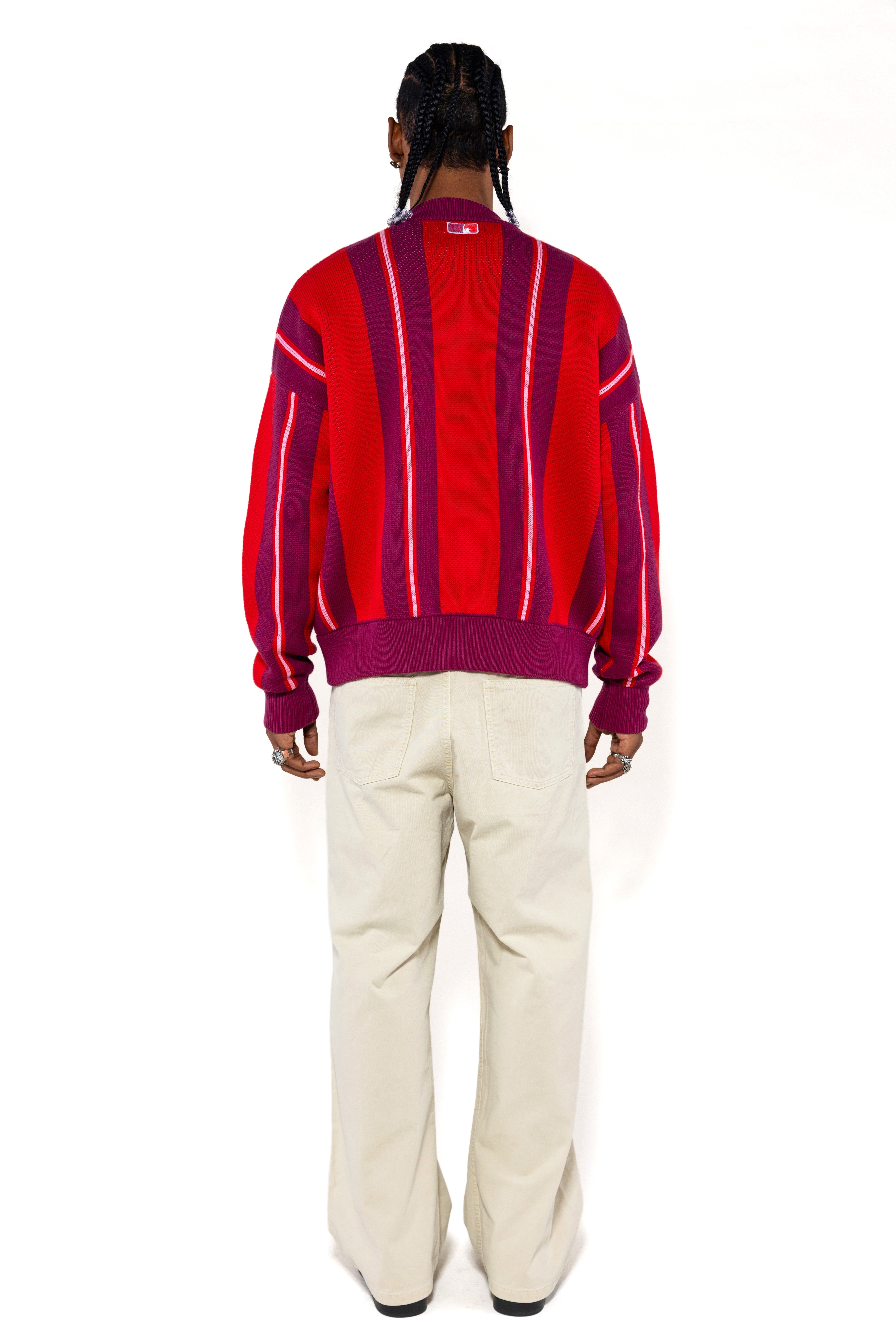 Full body rear view of a Male Model Wearing the Wisdom Of Age City Cardigan in Red Velvet on a white background.