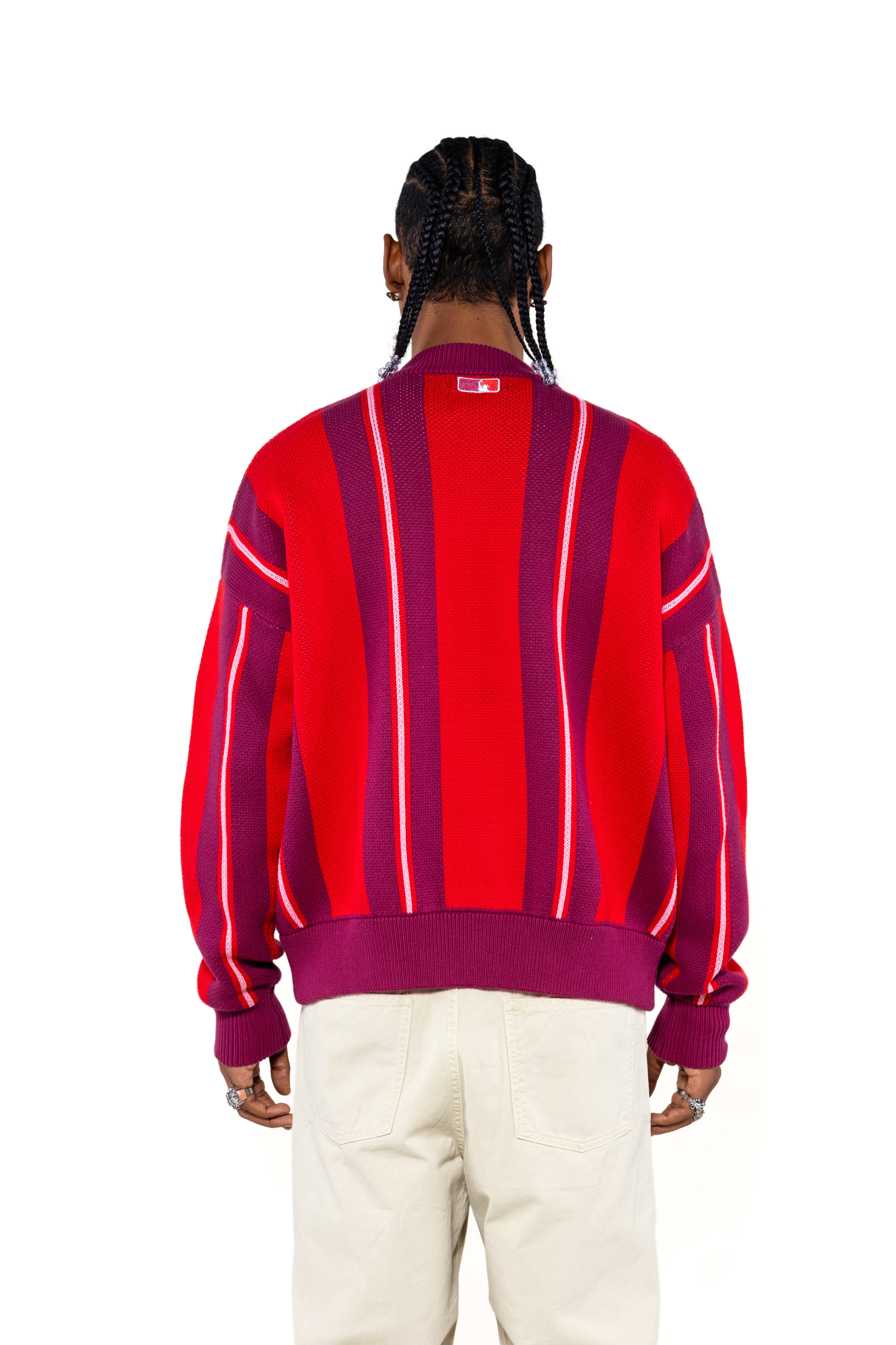 Rear View of a Male Model Wearing the Wisdom Of Age City Cardigan in Red Velvet on a white background.