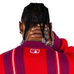 close rear view of a Male Model Wearing the Wisdom Of Age City Cardigan in Red Velvet on a white background.