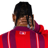 close rear view of a Male Model Wearing the Wisdom Of Age City Cardigan in Red Velvet on a white background.