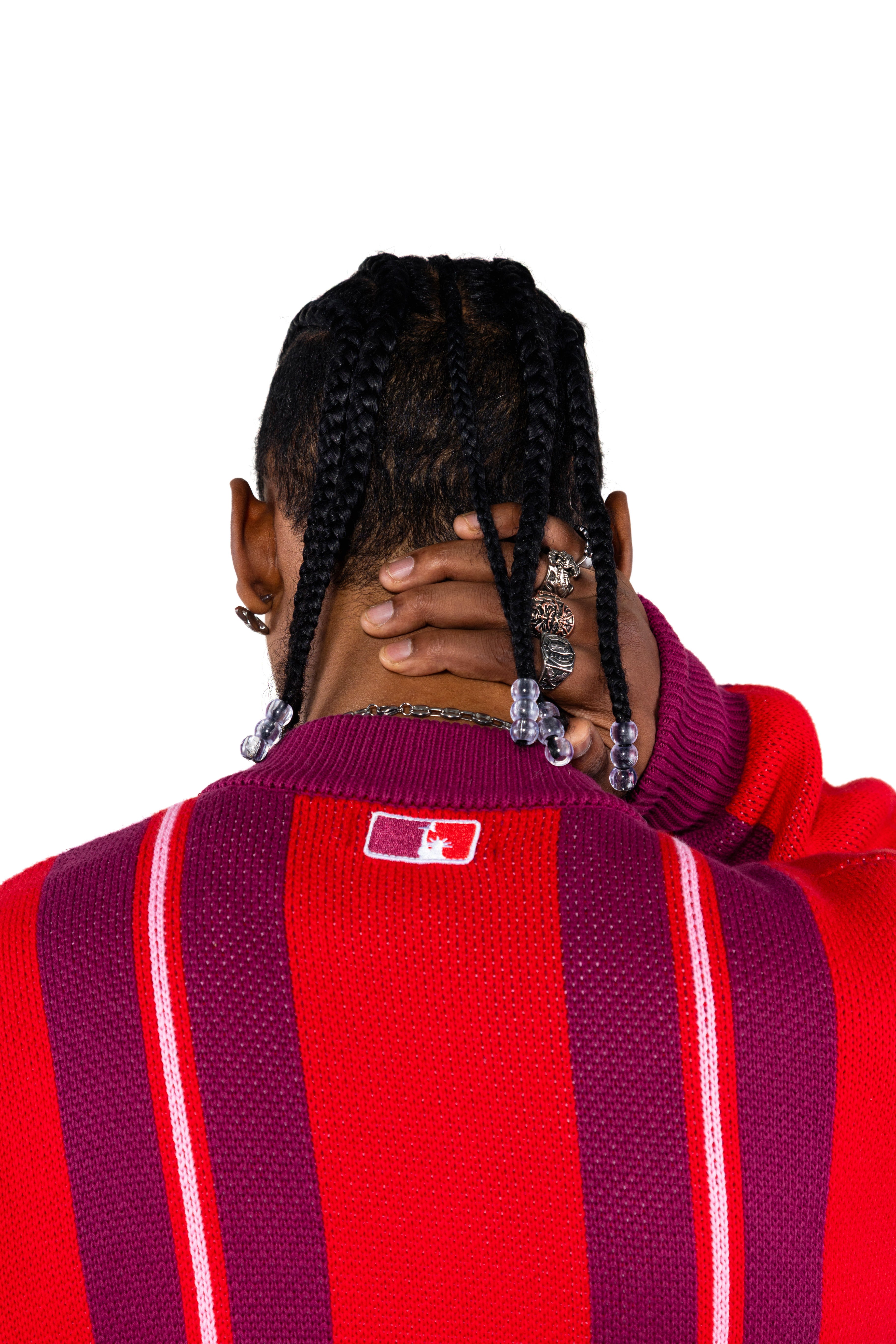 close rear view of a Male Model Wearing the Wisdom Of Age City Cardigan in Red Velvet on a white background.