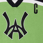 Close Up Of The Wisdom Of Age Knit Hockey Jersey Neon Front View