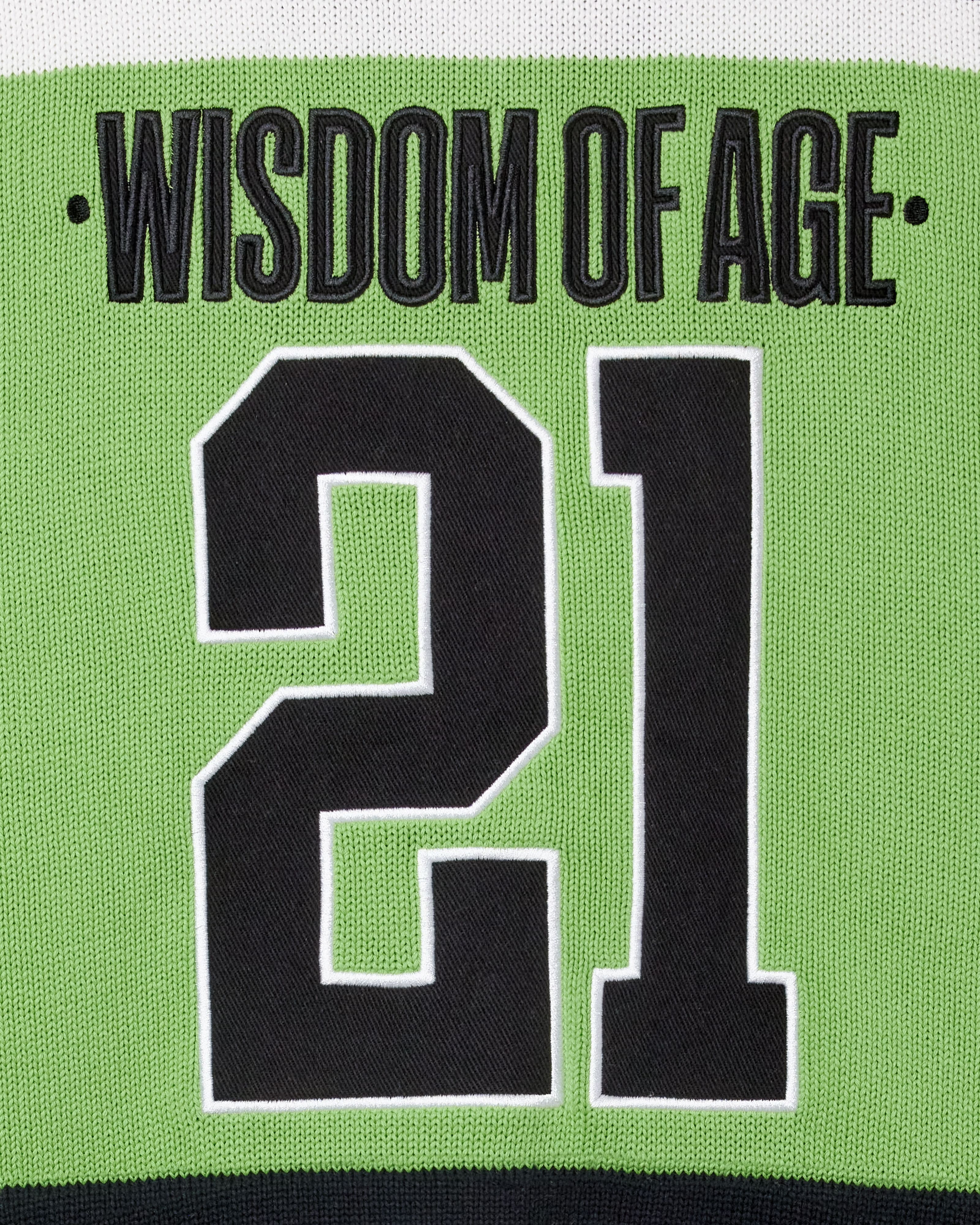 Close Up Of The Wisdom Of Age Knit Hockey Jersey Neon Rear View. Wisdom Of Age on the nameplate. The number 21 under.
