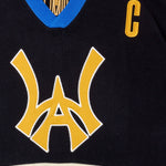 Close Up Of The Wisdom Of Age Knit Hockey Jersey Black Front View