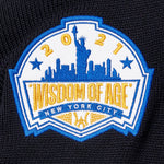 Patch with 'Wisdom of Age 2021 New York City' design on a black background