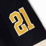Black sweater with yellow number 21 on a white background