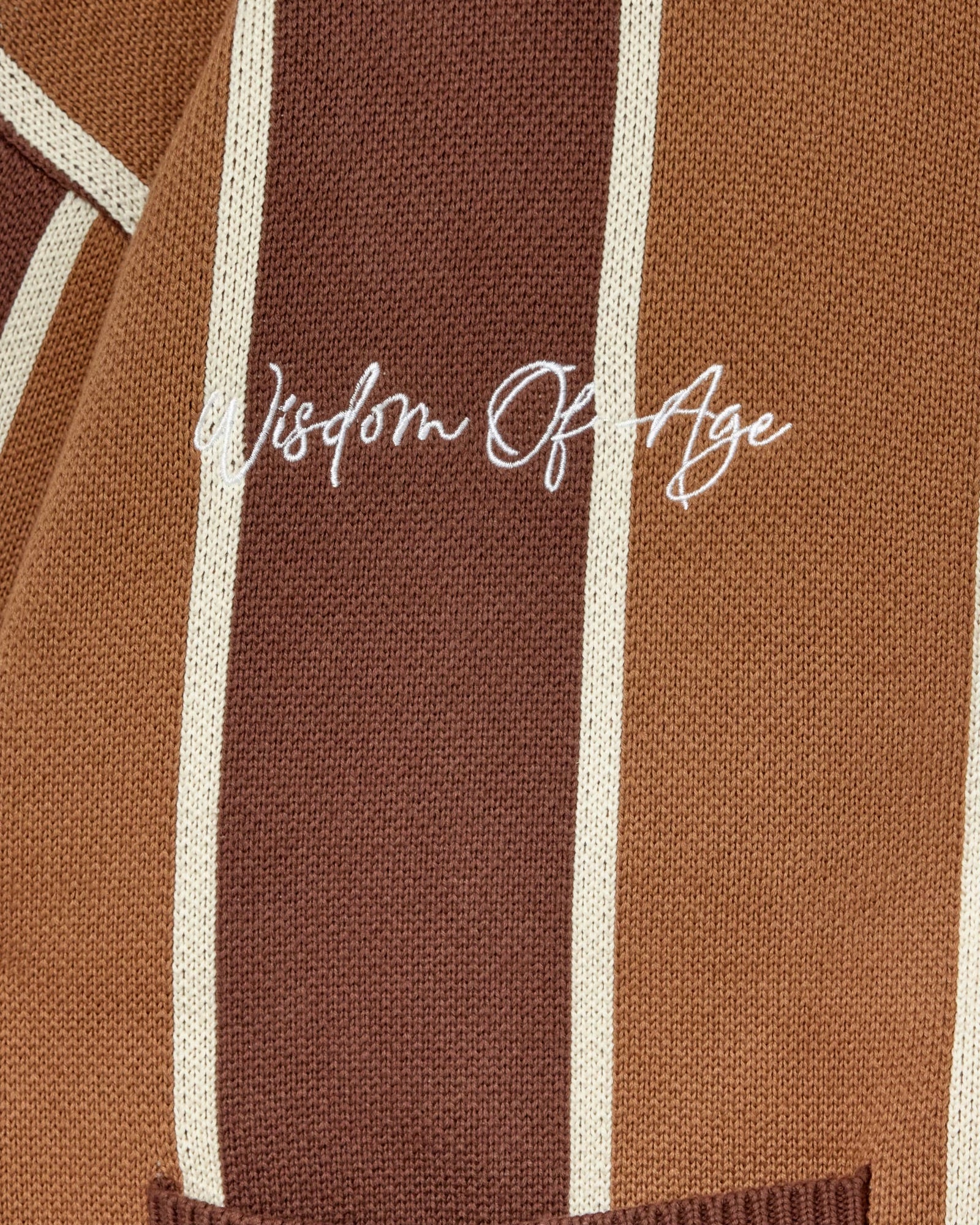 Brown knitted fabric with 'Wisdom of Age' embroidery