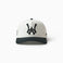 Wisdom of Age white snapback hat featuring embroidered logo and structured A-frame silhouette on white background.