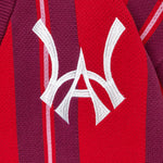 Close-up of a red and maroon Cardigan with the WA logo.