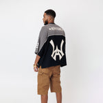 Rear View of Male Model wearing the WOA Football jersey V2 Slate on a white background