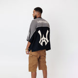 Rear View of Male Model wearing the WOA Football jersey V2 Slate on a white background