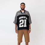 Male Model wearing a the WOA Football jersey V2 Slate with 'Wisdom Of Age' and number '21' embroidered on the front on a white background