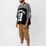 Side view Male Model wearing the WOA Football jersey V2 Slate with number 21 on a white background