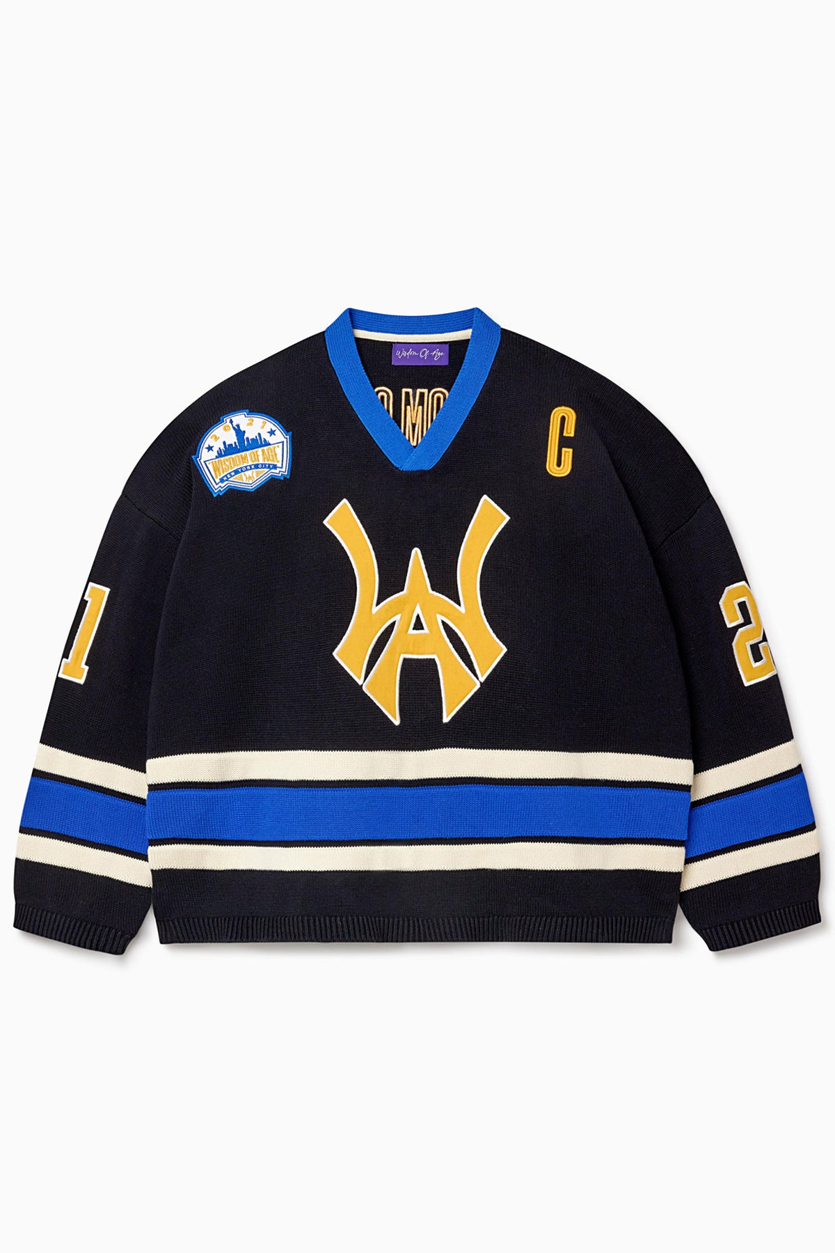 Front view of the Wisdom Of Age Knit Hockey jersey Black. Yellow WA logo on the front with and captains C on the left shoulder and a nyc skyline patch on the right shoulder. the number 21 on the sleeves