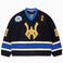 Front view of the Wisdom Of Age Knit Hockey jersey Black. Yellow WA logo on the front with and captains C on the left shoulder and a nyc skyline patch on the right shoulder. the number 21 on the sleeves
