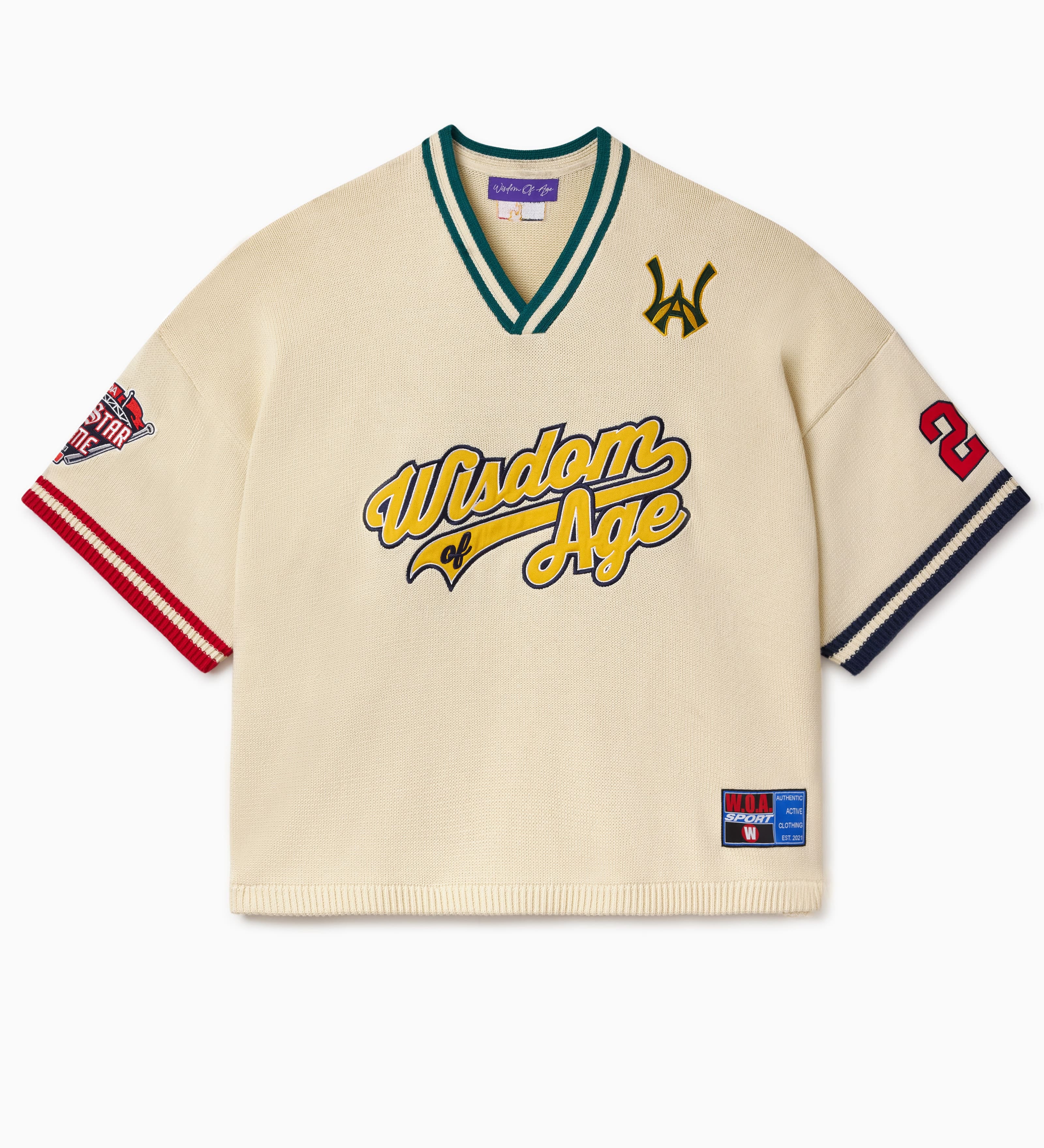 Knitted Baseball Jersey in Cream with 'Wisdom of Age' written in text and various logos on a white background