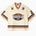 Cream-colored football jersey with 'Wisdom of Age 2021' logo on a white background