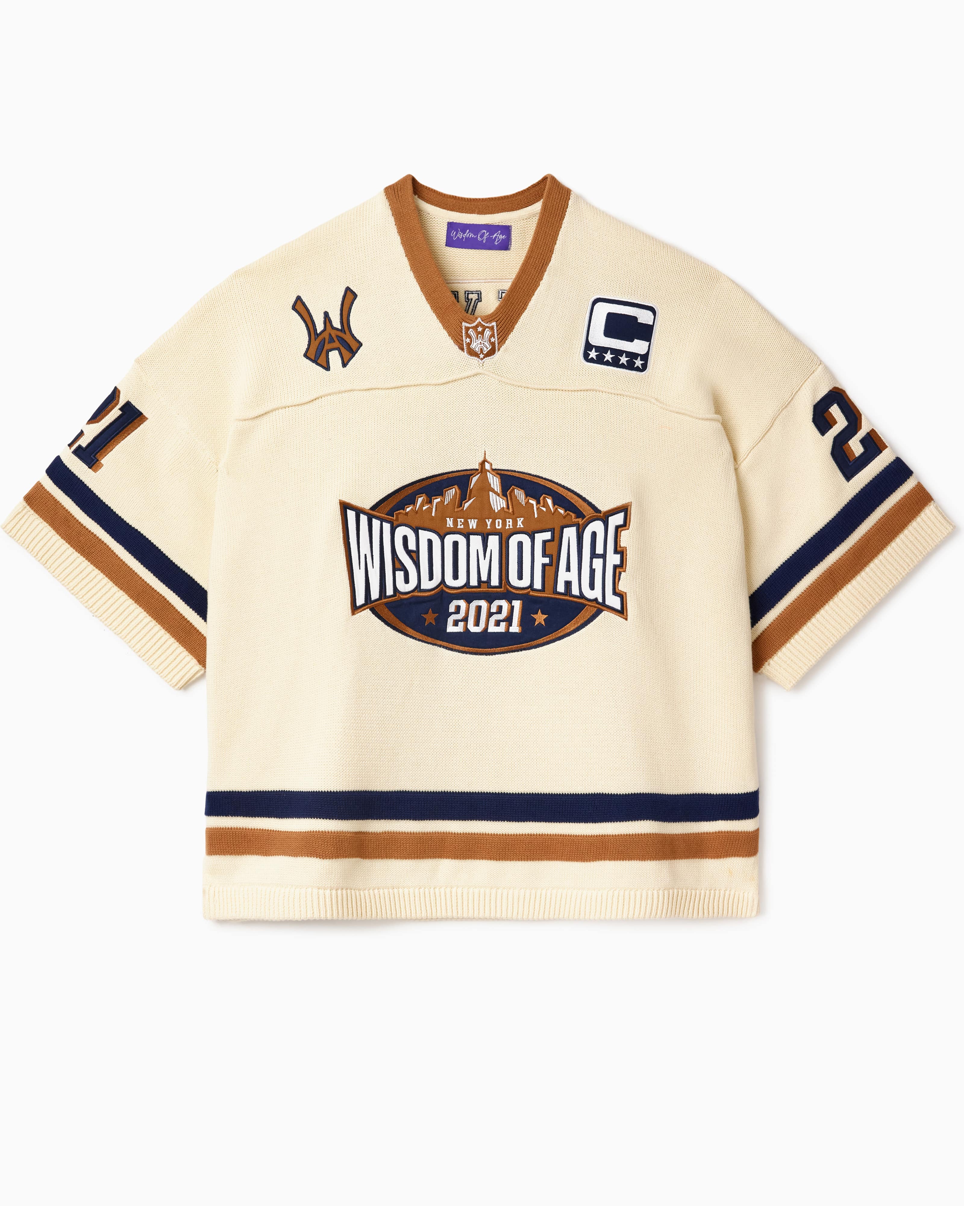 Cream-colored football jersey with 'Wisdom of Age 2021' logo on a white background