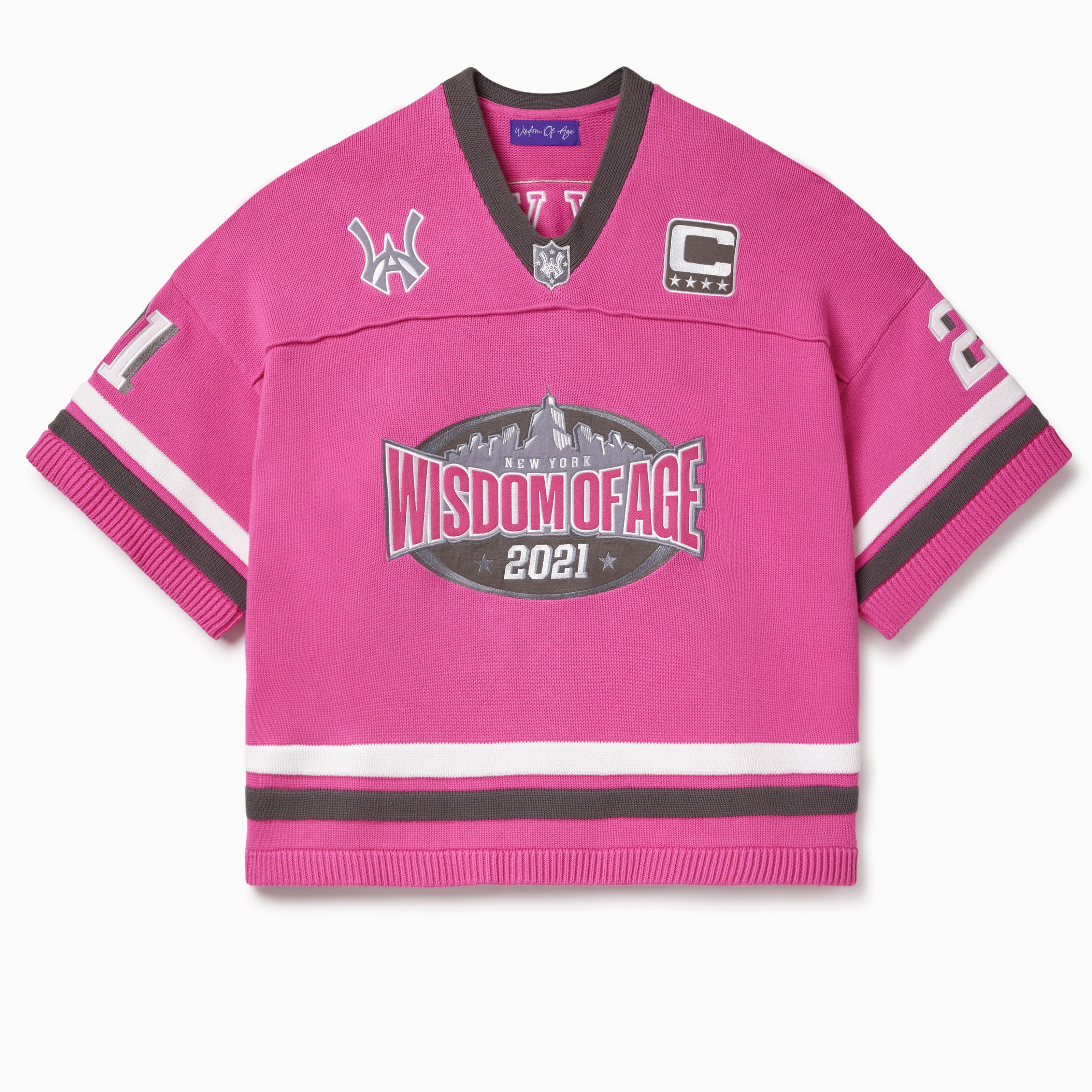 Pink knitted football  jersey with Wisdom Of Age skyline, WA logos anda captains patch.