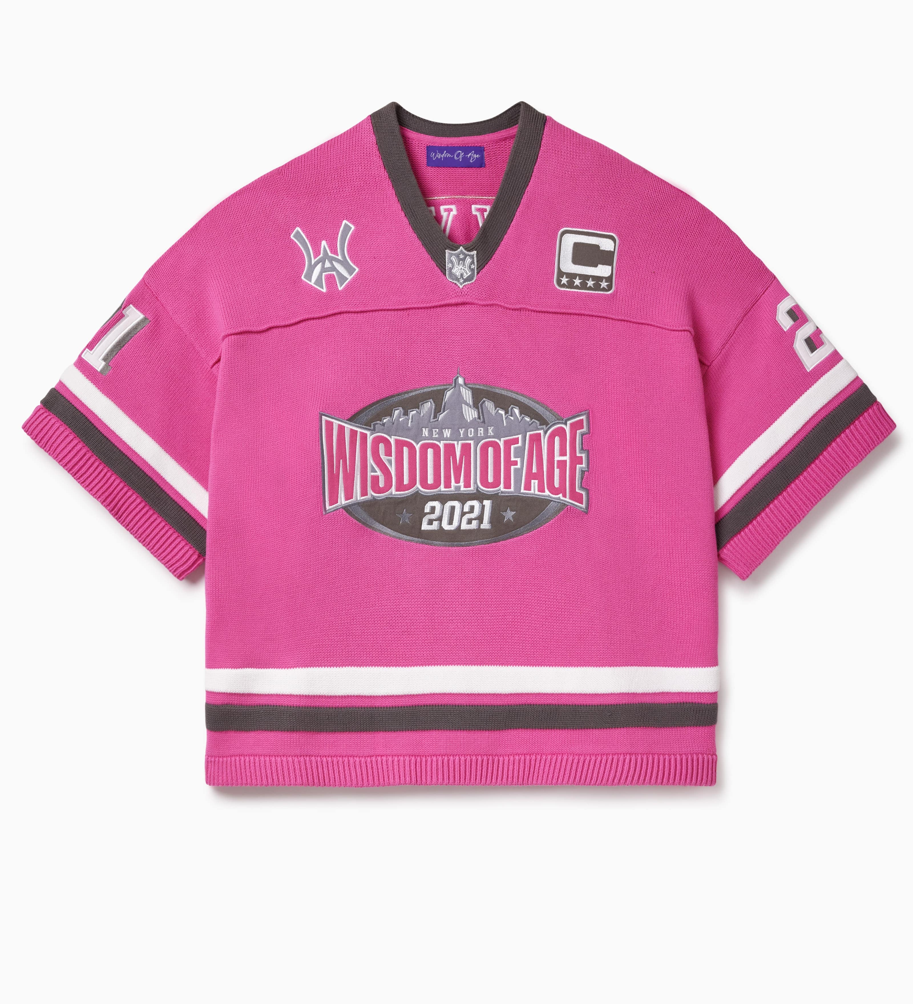 Pink knitted football  jersey with Wisdom Of Age skyline, WA logos anda captains patch.