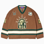 Front view of the Wisdom Of Age Knit Hockey jersey Autumn. WOA Liberty logo on the front with  and captains C on the left shoulder and a WA patch on the right shoulder. the number 21 on the sleeves