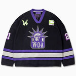 Front view of the Wisdom Of Age Knit Hockey jersey Midnight. WOA Liberty logo on the front with  and captains C on the left shoulder and a WA patch on the right shoulder. the number 21 on the sleeves