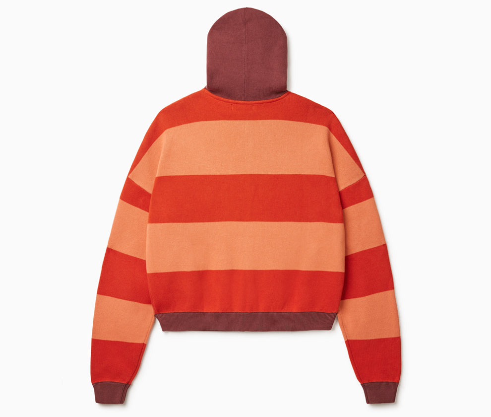 Rear View Of the Wisdom Of Age Knit Zippered Hoodie. There are alternating horizontal orange stripes. One stripe is a darker shade of Orange. 