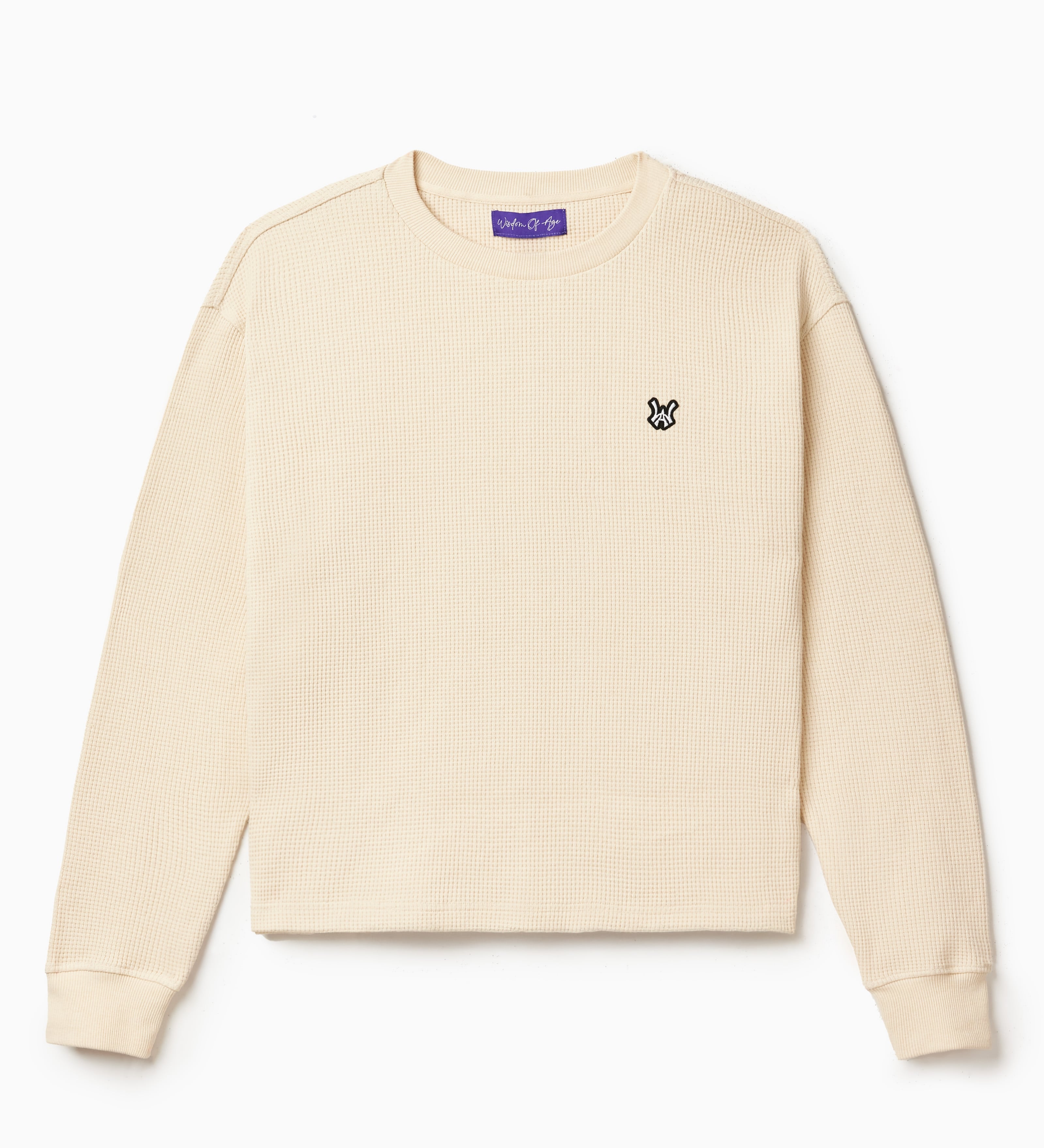 Front view of the Wisdom Of Age knit thermal shirt in cream. WA logo embroidered on the left chest.